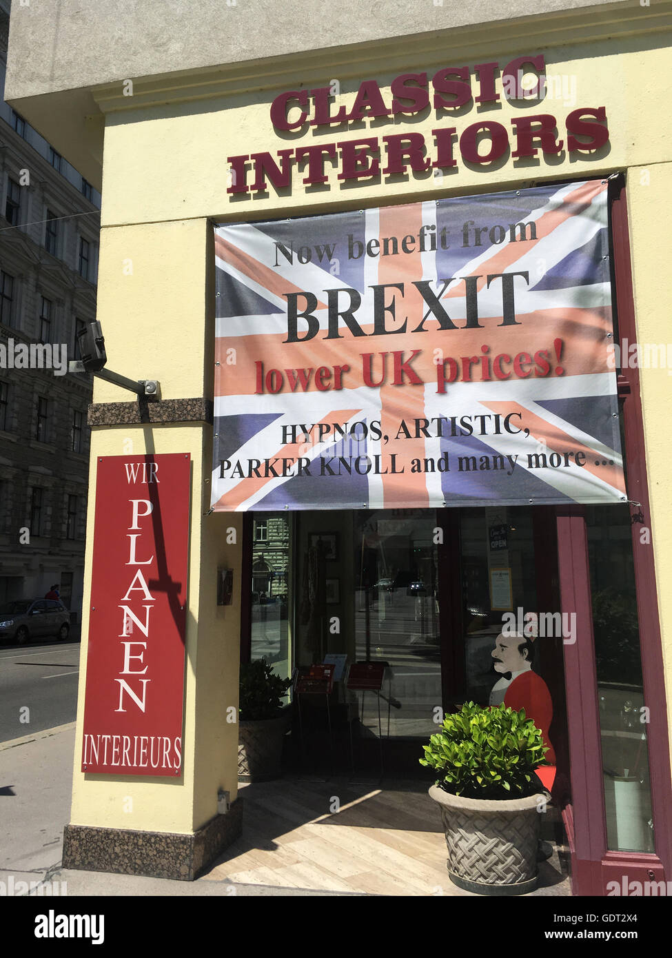 Vienna, Austria 21st July 2016 Writing on a Union Jack flag at a shop entrance in Vienna city centre which reflects the value of sterling having fallen since BREXIT and which for them is good news as products from their UK suppliers have become cheaper for them to purchase and in consequence their Austrian customers to obtain 'lower UK prices'. (c) K Hext/Alamy Live News Stock Photo