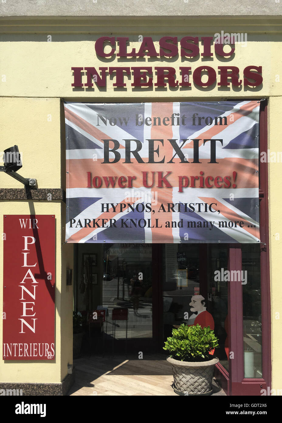 Vienna, Austria 21st July 2016 Writing on a Union Jack flag at a shop entrance in Vienna city centre which reflects the value of sterling having fallen since BREXIT and which for them is good news as products from their UK suppliers have become cheaper for them to purchase and in consequence their Austrian customers to obtain 'lower UK prices'. (c) K Hext/Alamy Live News Stock Photo