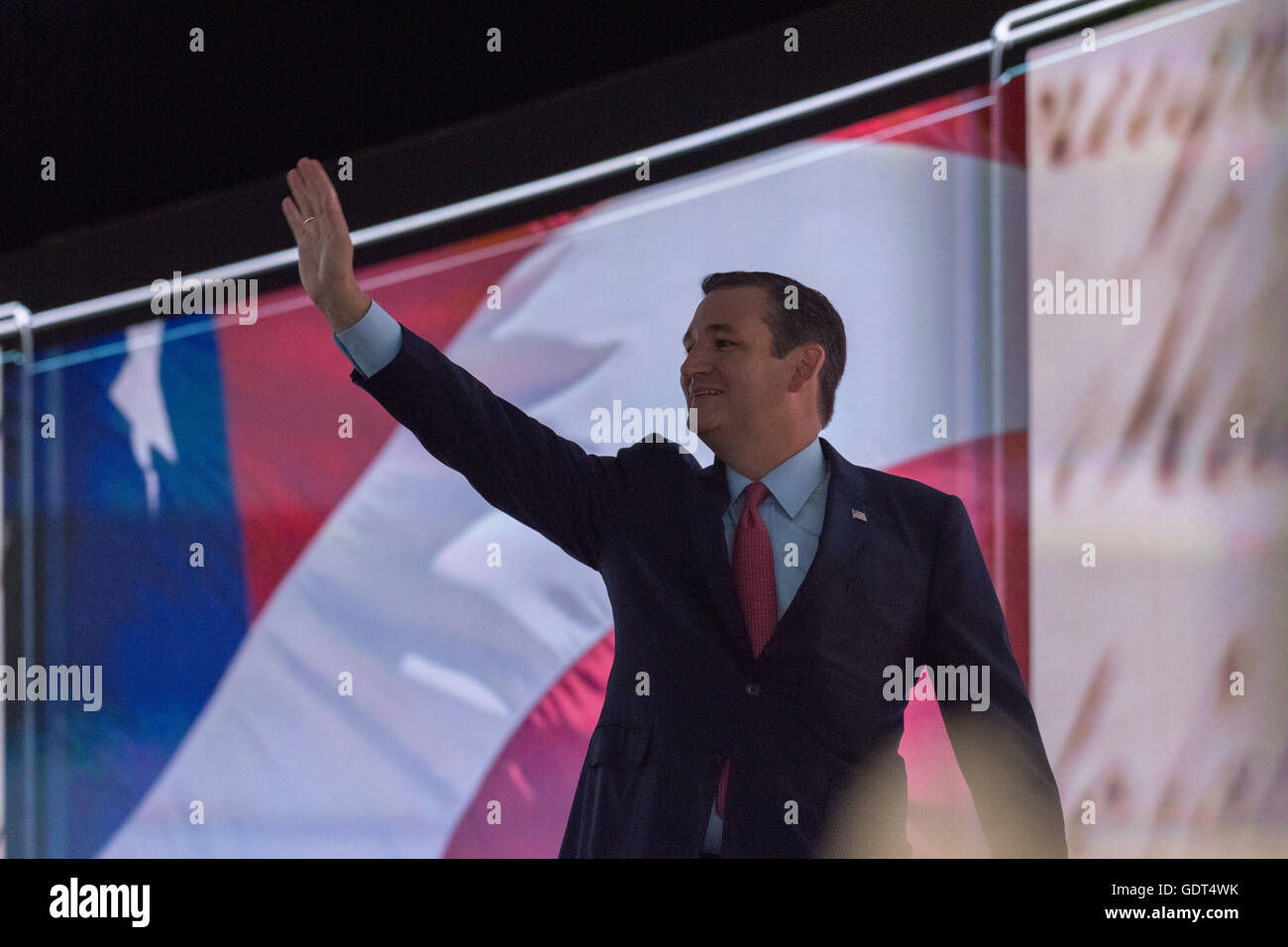 Senator Ted Cruz walks off stage in the dark after being cut off by officials during his addresses during the third day of the Republican National Convention July 20, 2016 in Cleveland, Ohio. Cruz spoke without endorsing Republican Presidential candidate Donald Trump and told delegates to vote with their conscience. Stock Photo