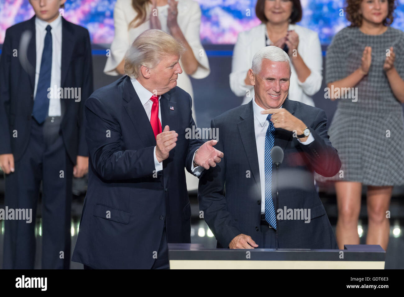 Cleveland, Ohio, USA. 21st July, 2016. GOP Presidential candidate Donald Trump stands with running mate Gov. Mike Pence as balloons and confetti drop after accepting the party nomination for president on the final day of the Republican National Convention July 21, 2016 in Cleveland, Ohio. Credit:  Planetpix/Alamy Live News Stock Photo