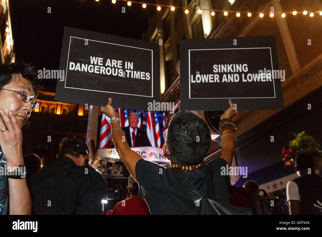 Cleveland, Ohio, USA. 21st July, 2016. Cleveland, Ohio, USA. 21st July, 2016. Laurie Arbeiter of the group We Will Not Be Silent holds up signs during Trump's telecasted speech outside The Republican National Convention. © John Orvis/Alamy Live News Credit:  John Orvis/Alamy Live News Stock Photo