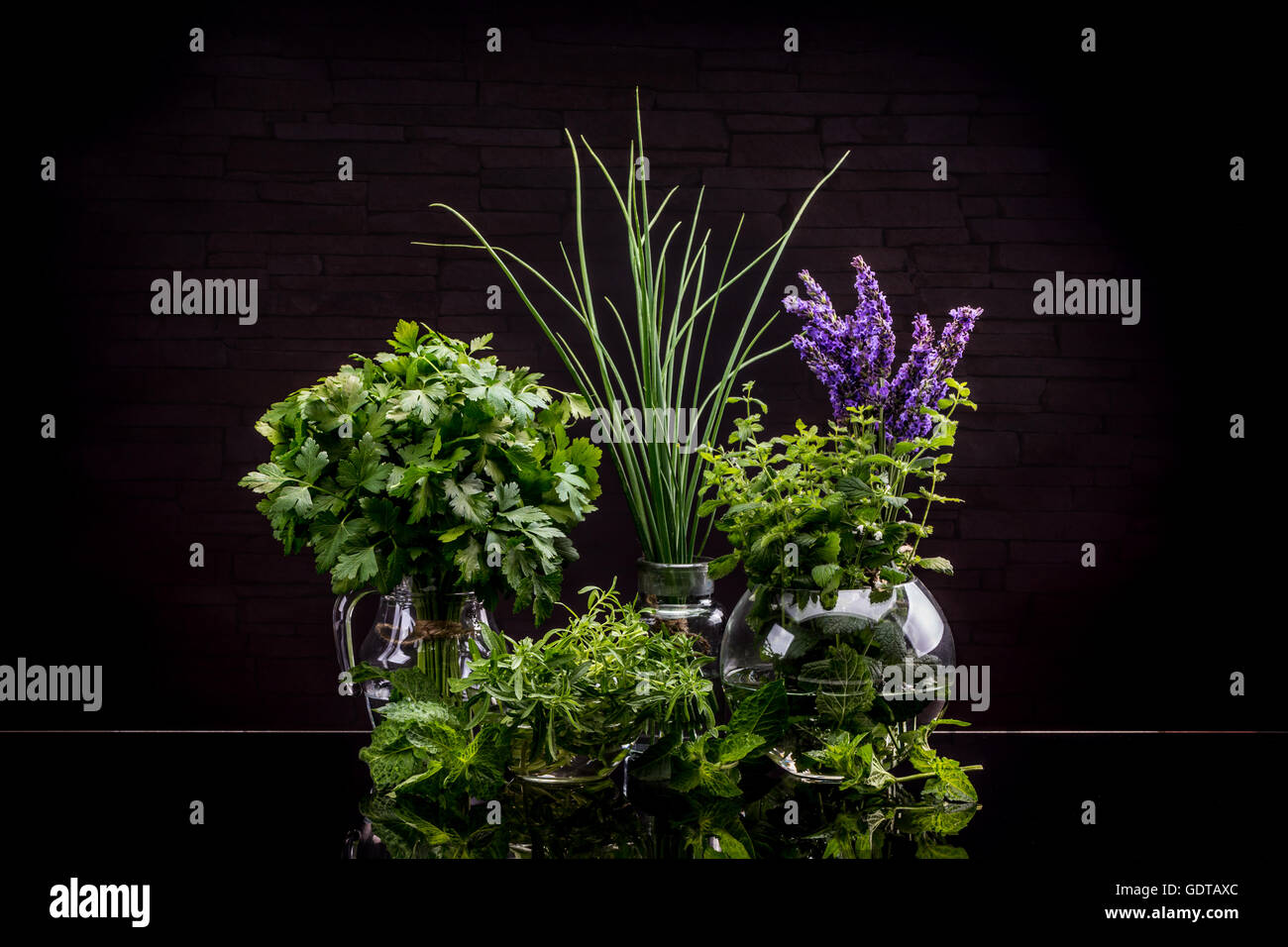 Bunch of garden fresh herbs on black background Stock Photo Alamy