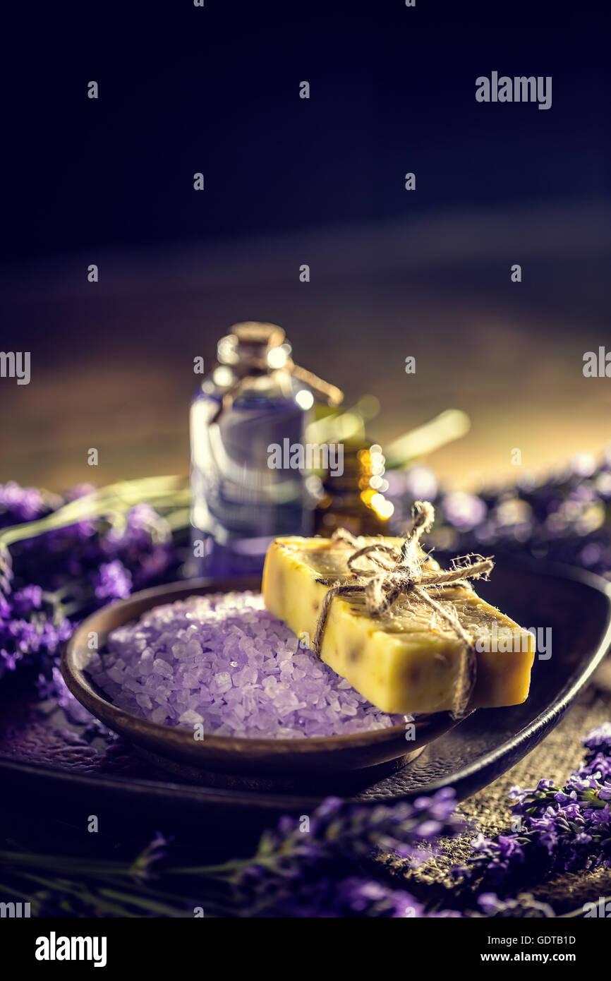 Beauty treatment concept with bath salt, bar of soap and essential oil Stock Photo