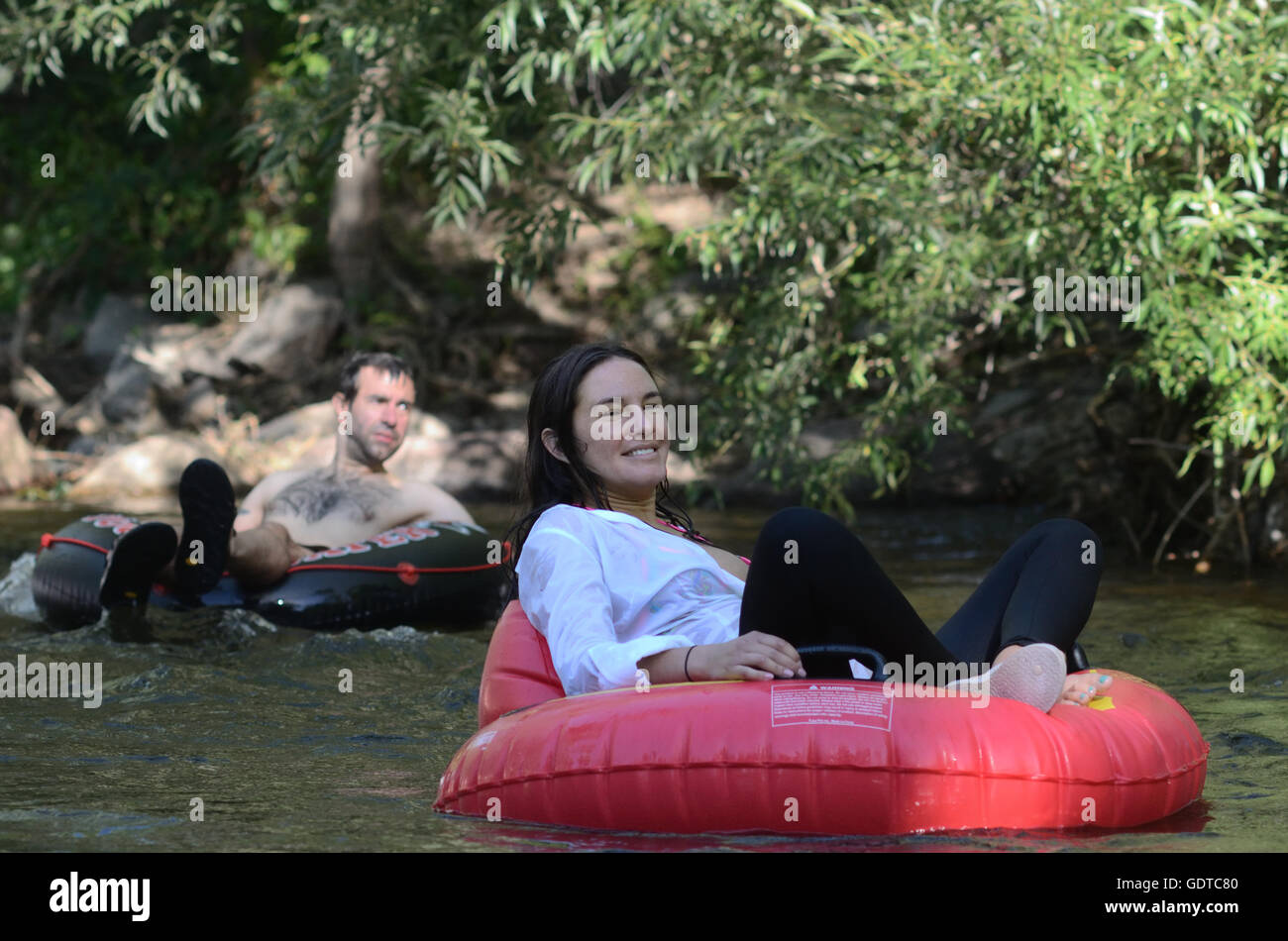 Tube to Work Day: a unique event during  which residents ride inner tubes and other flotation devices on Boulder Creek. Stock Photo