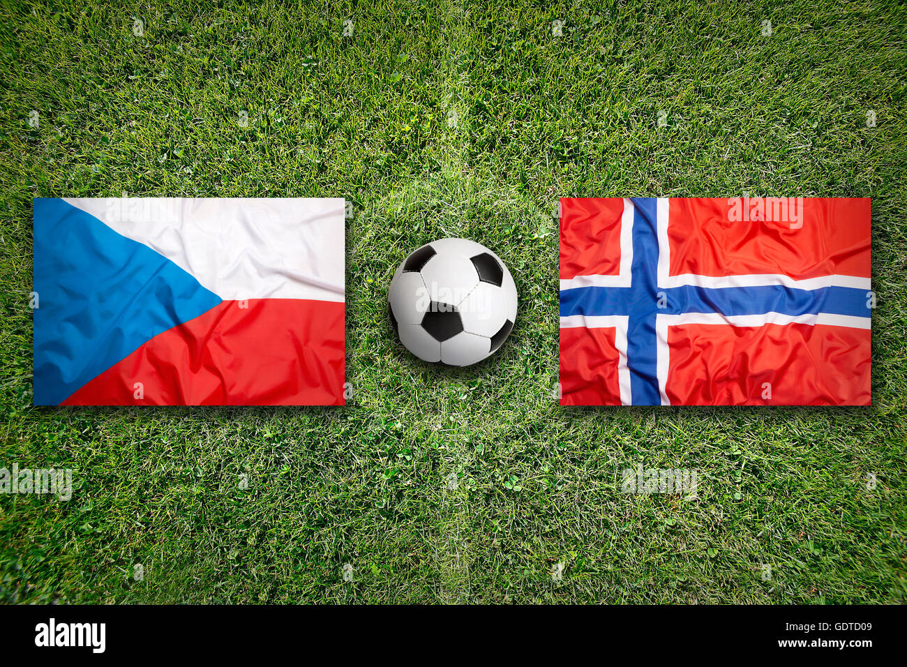 Czech Republic vs. Norway flags on green soccer field Stock Photo