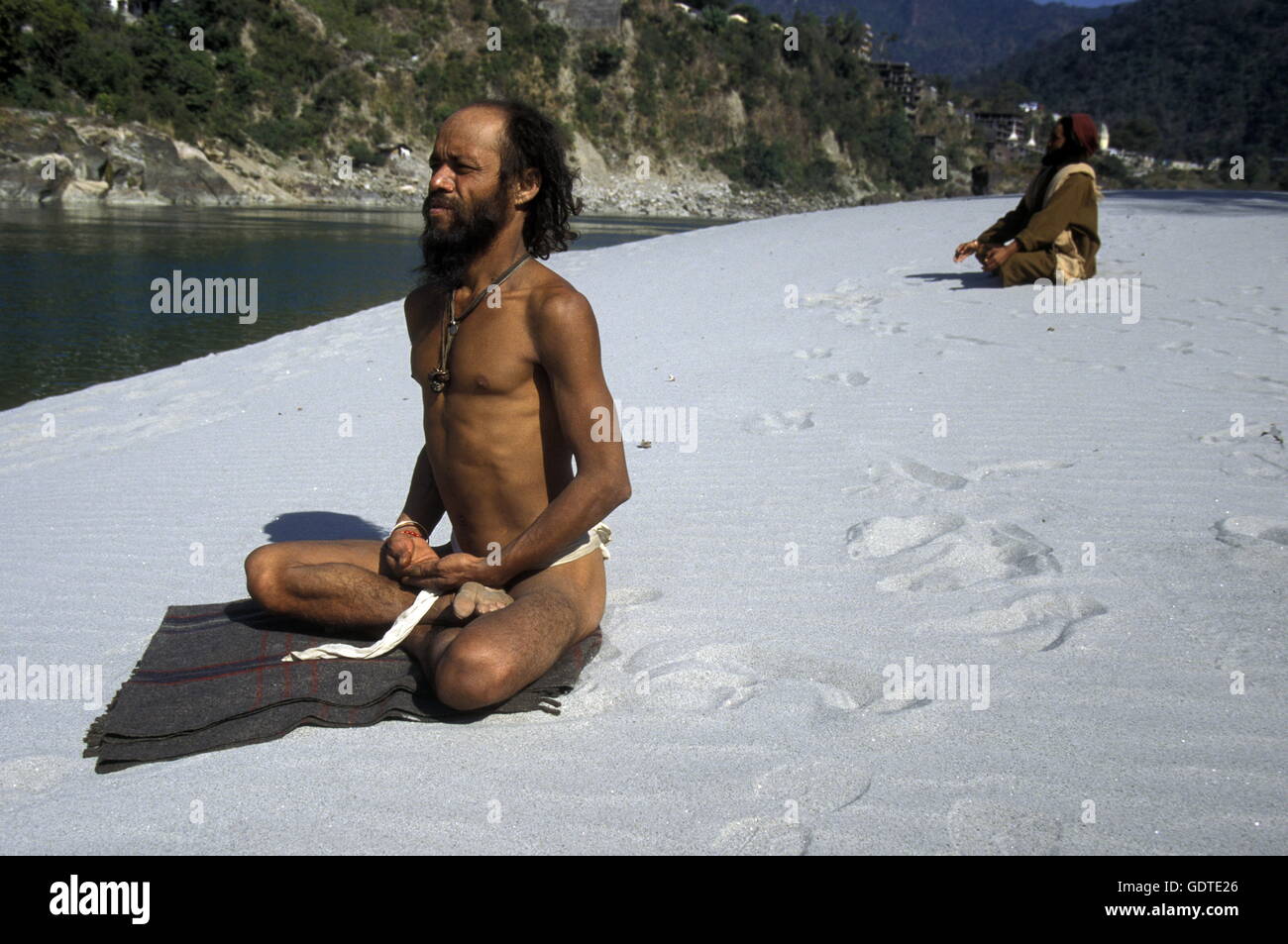 two men on the Ganges River in the town of Rishikesh in the Province Uttar Pradesh in India. Stock Photo