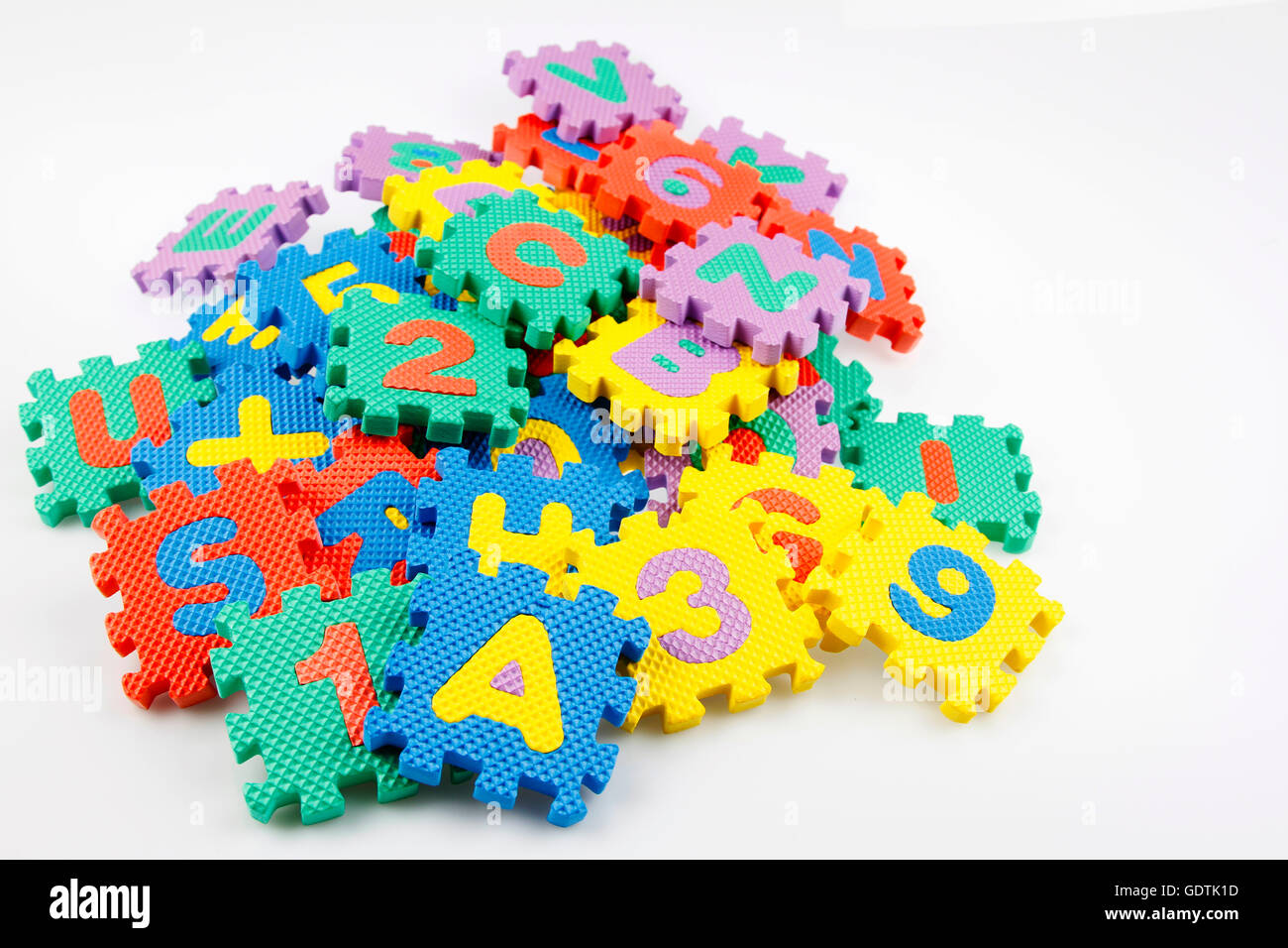 Alphabet and number puzzle pieces Stock Photo - Alamy