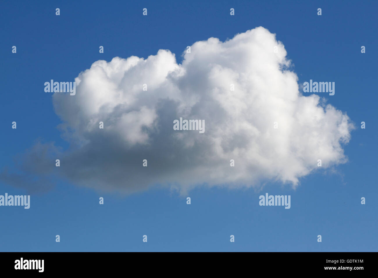 Single white fluffy cloud on blue Stock Photo