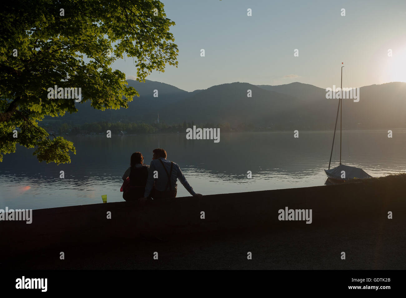 GERMANY, Bavaria, Tegernsee, May 28, 2016. A couple at the shore of the Tegernsee. Stock Photo