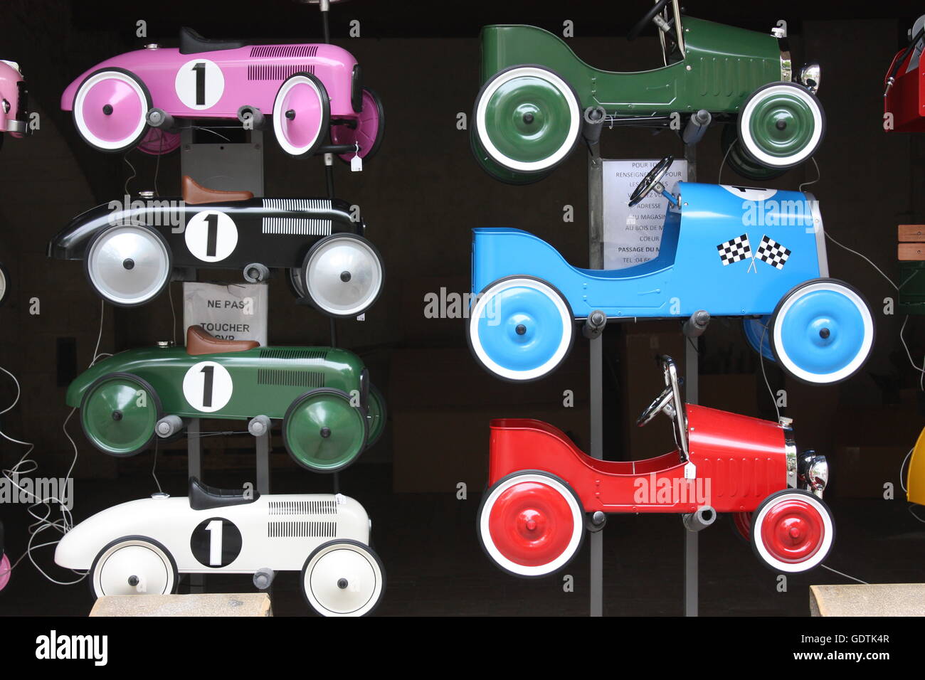 Toy cars available for rent on the Places des Herbes, Uzes, Provence
