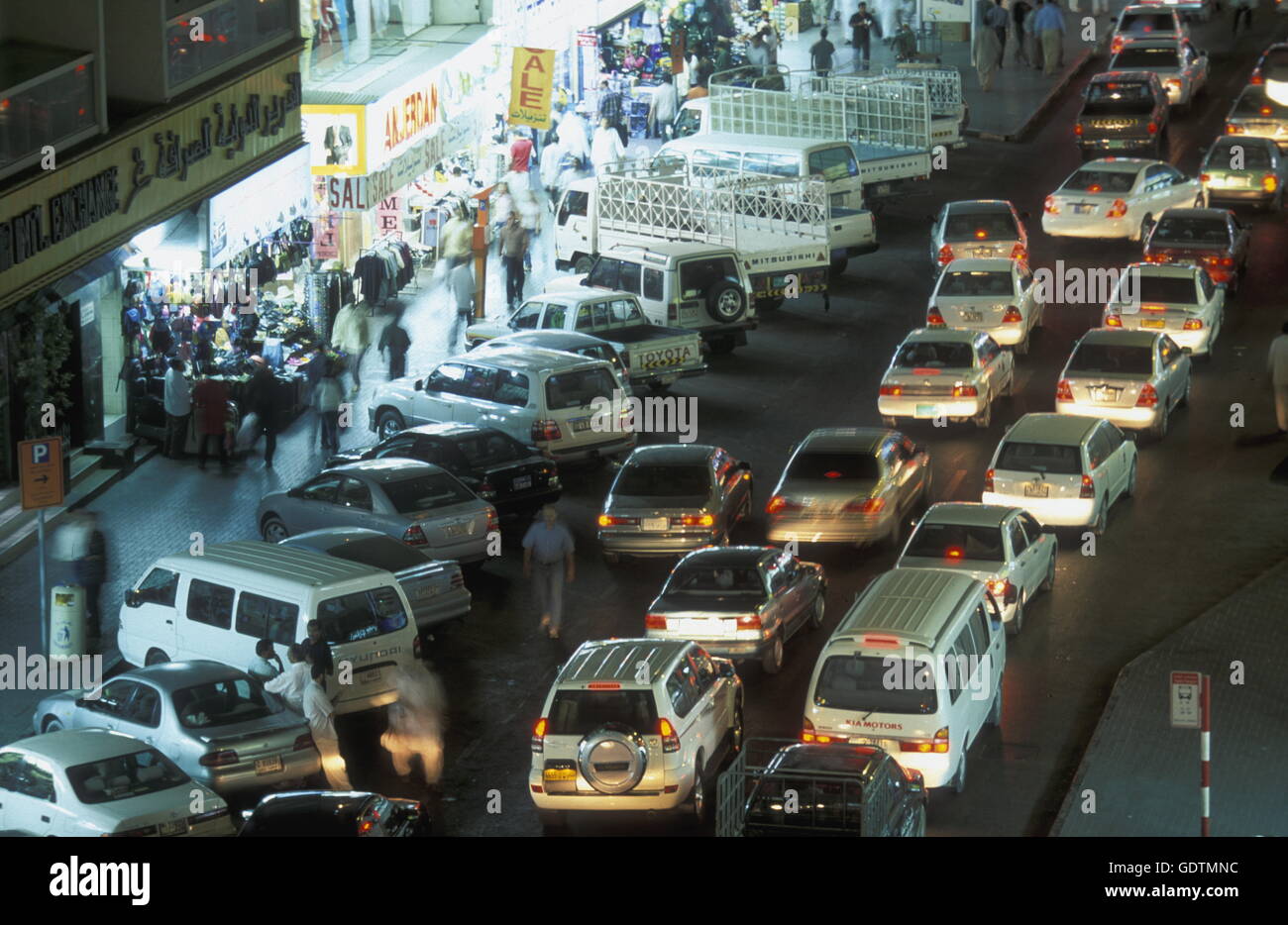 a road at night in the old town in the city of Dubai in the Arab Emirates in the Gulf of Arabia. Stock Photo