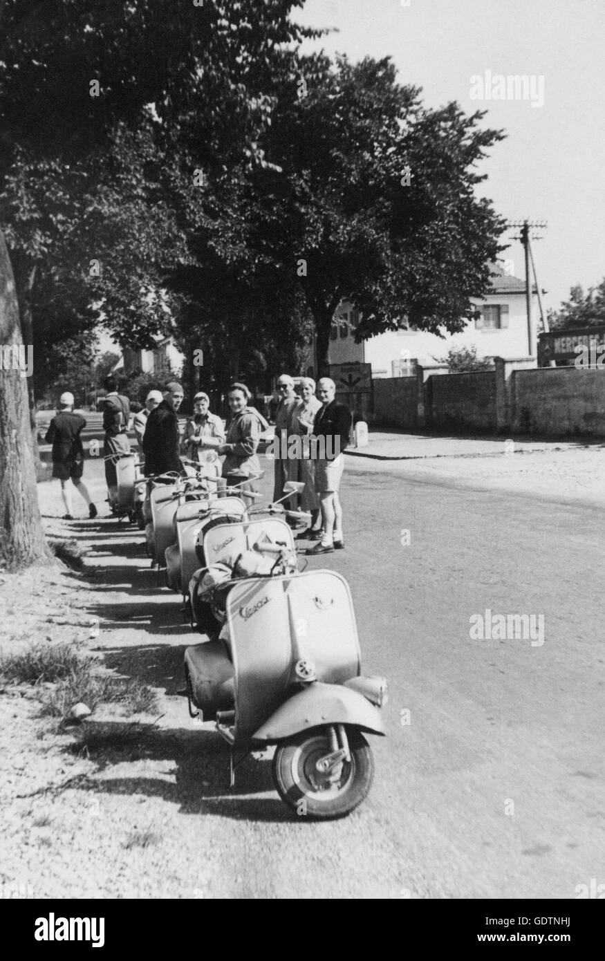 Parked Vespas on the roadside Stock Photo