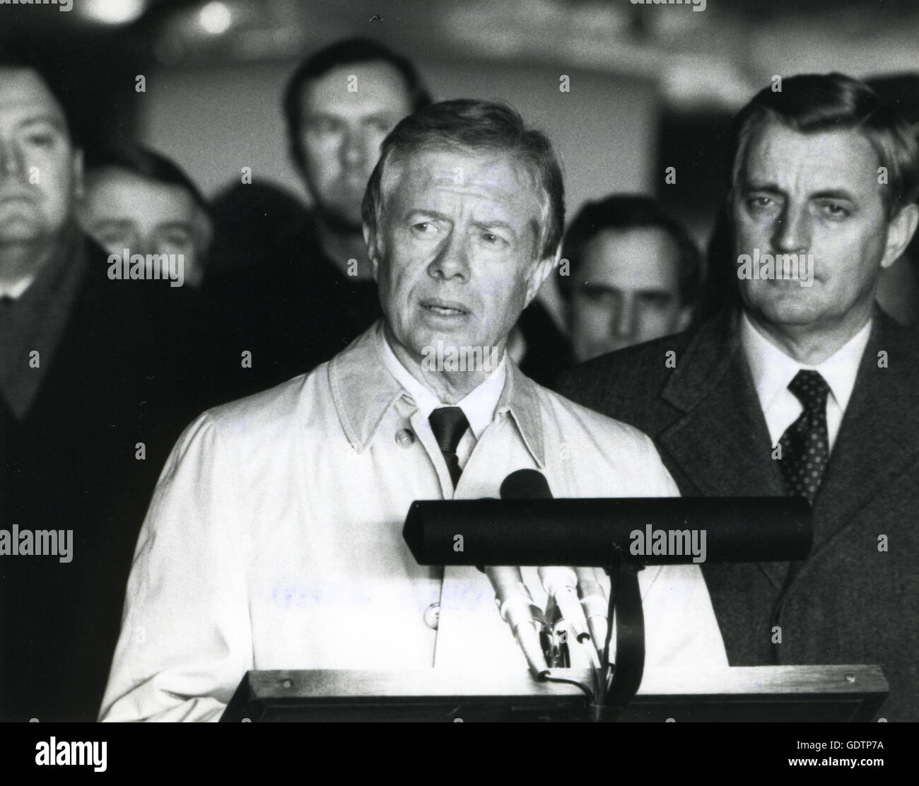 The 52 freed hostages, after their release from Iran, and former Vice-President Walter Mondale listen as Former President Jimmy Carter speaks to a crowd. Stock Photo