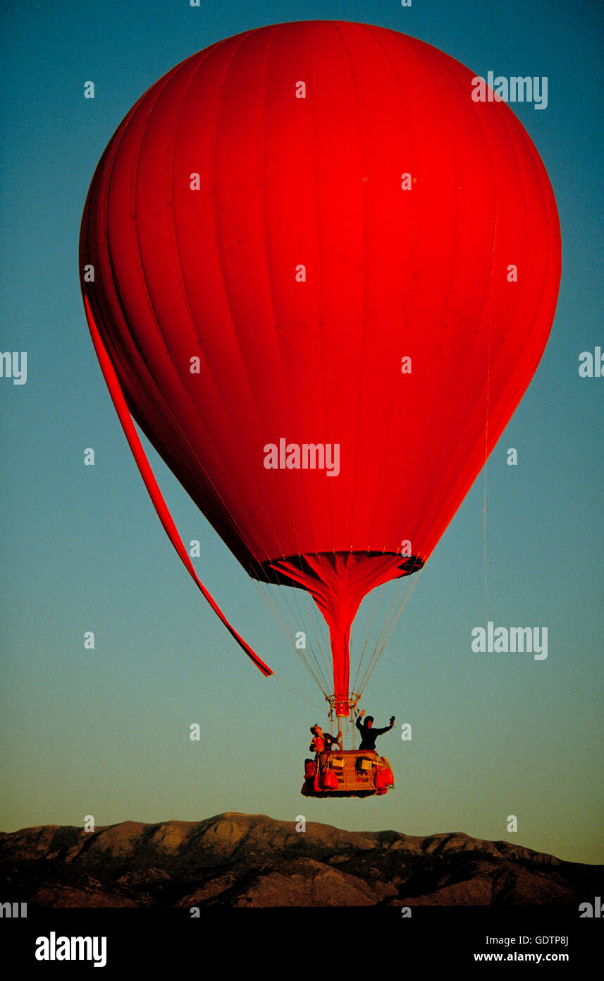 A helium gas balloon lifts off at the Albuquerque International Balloon ...