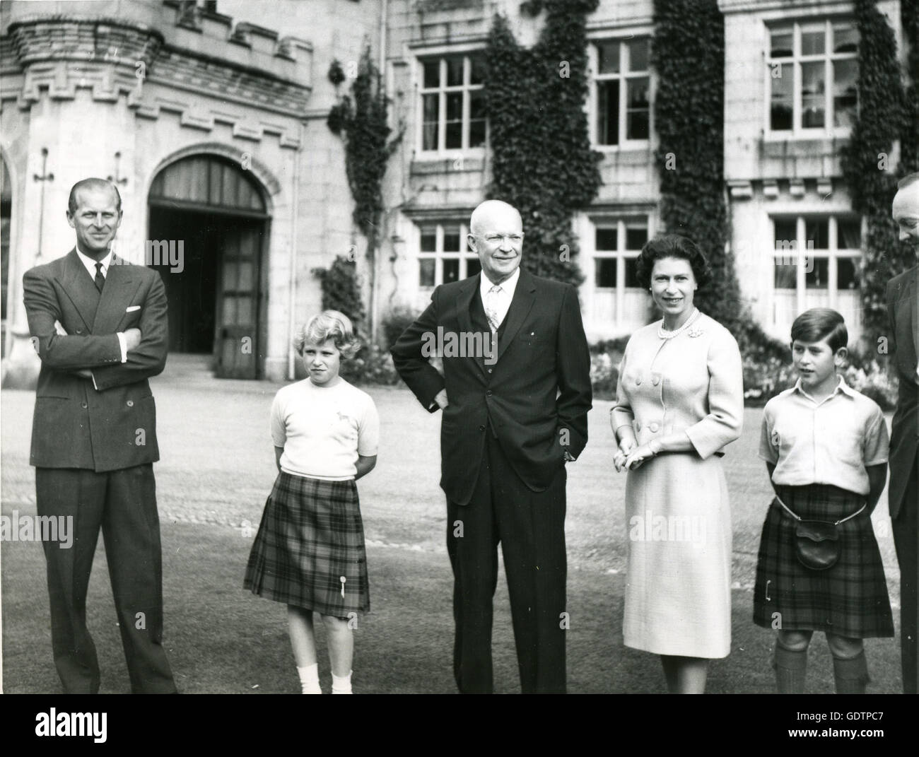 President of the United States, Dwight D. Eisenhower, stands outside Balmoral Castle with members of the British Royal family. Left to right: Prince Philip, Princess Anne; The President; Queen Elizabeth; and Prince Charles. The President was visiting England for top level talks with British Prime Minister Harold Macmillan. Stock Photo