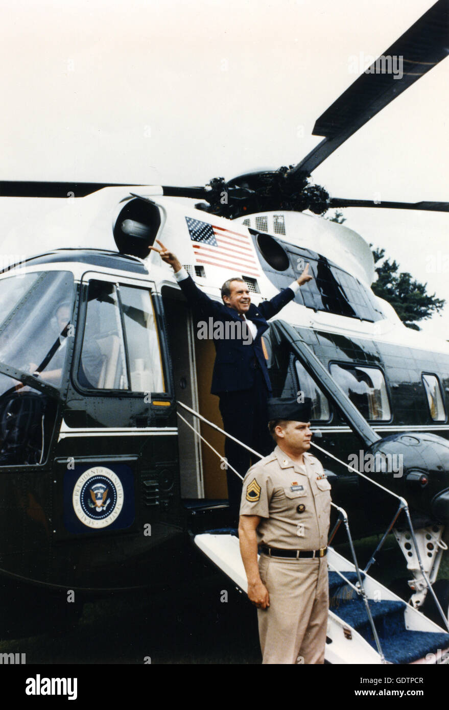 Former President Richard M. Nixon turns for a final farewell gesture to his staff as he boards the helicopter taking him to private life. Stock Photo
