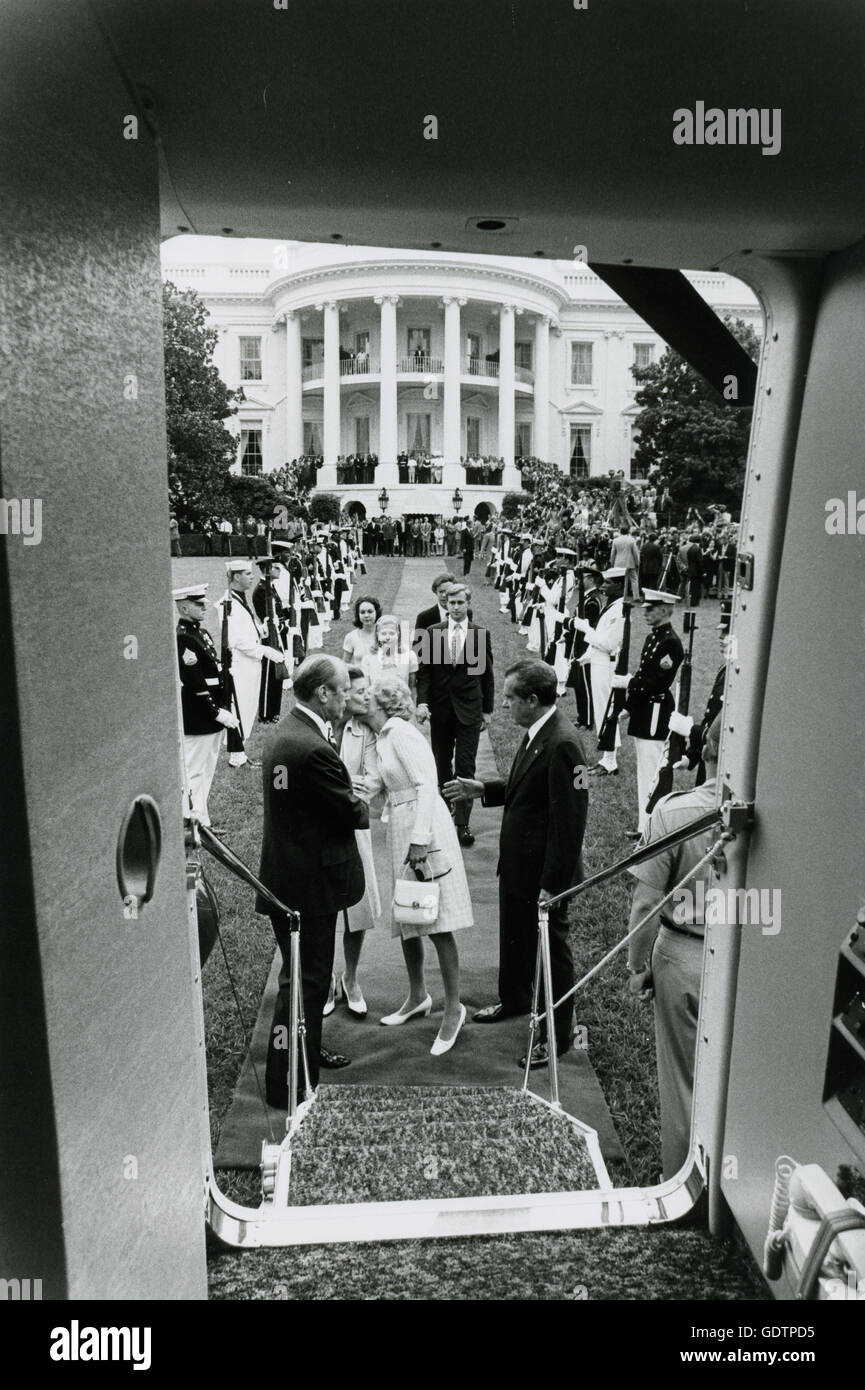 Former President Richard M. Nixon and his family say good-bye to President Gerald Ford and wife Betty as they prepare to board the helicopter taking them to private life. Stock Photo