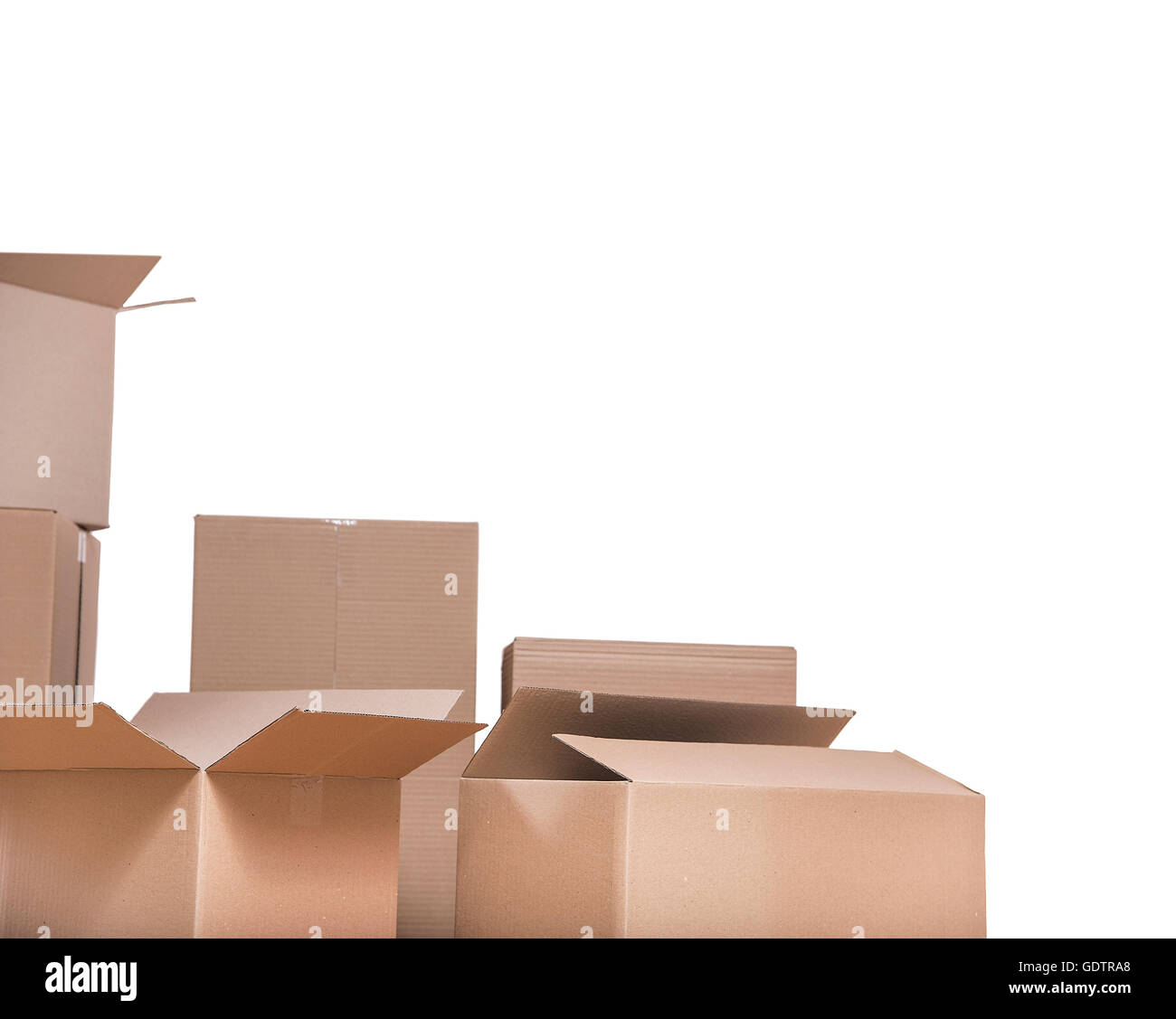 Parts of cardboard boxes partially on white background Stock Photo