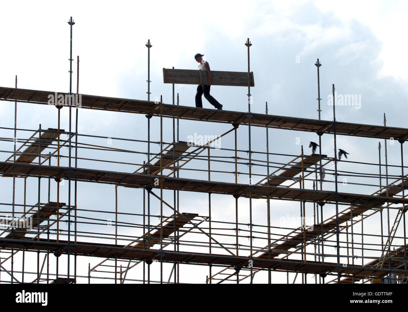 Construction workers on scaffolding Stock Photo Alamy
