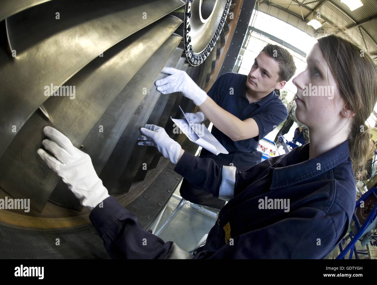 Aircraft mechanic training at a jet engine hires stock photography and
