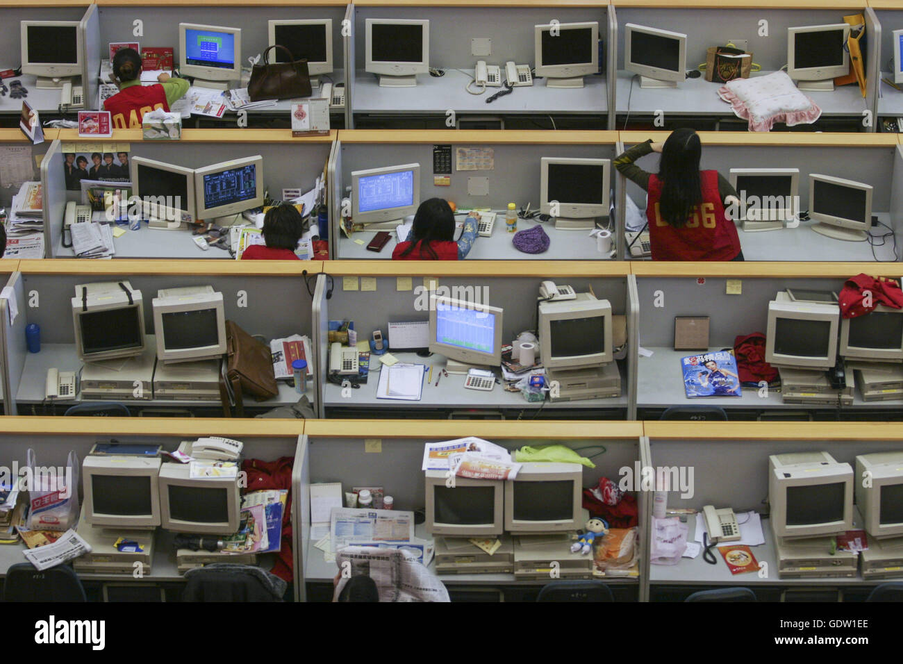 Chinese stock brokers at work inside the Shanghai Stock Exchange in
