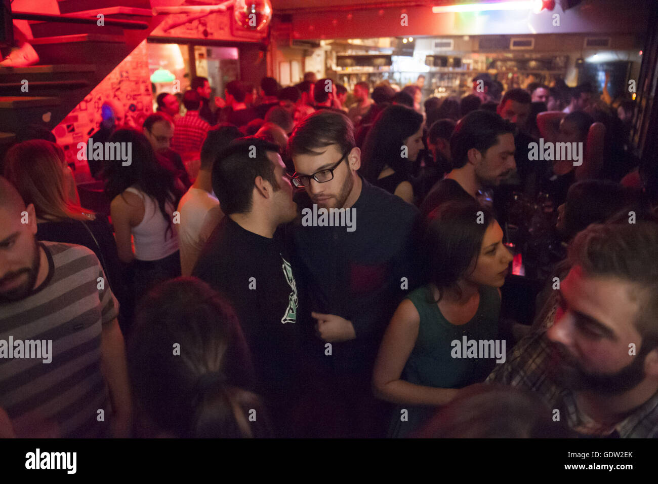 Young men and women in the 'La Dose' bar Stock Photo