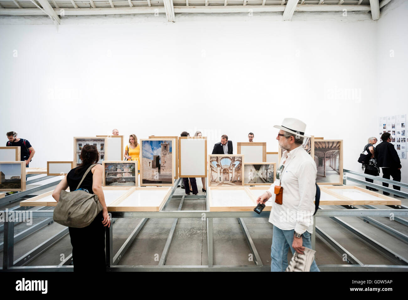 Interior view of pavilion displays and installations with visitors ...