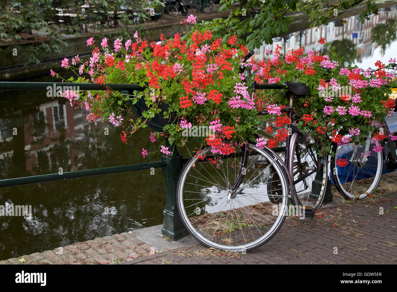 City center and bicycle parked on a bridge in Amsterdam, Netherlands Stock Photo