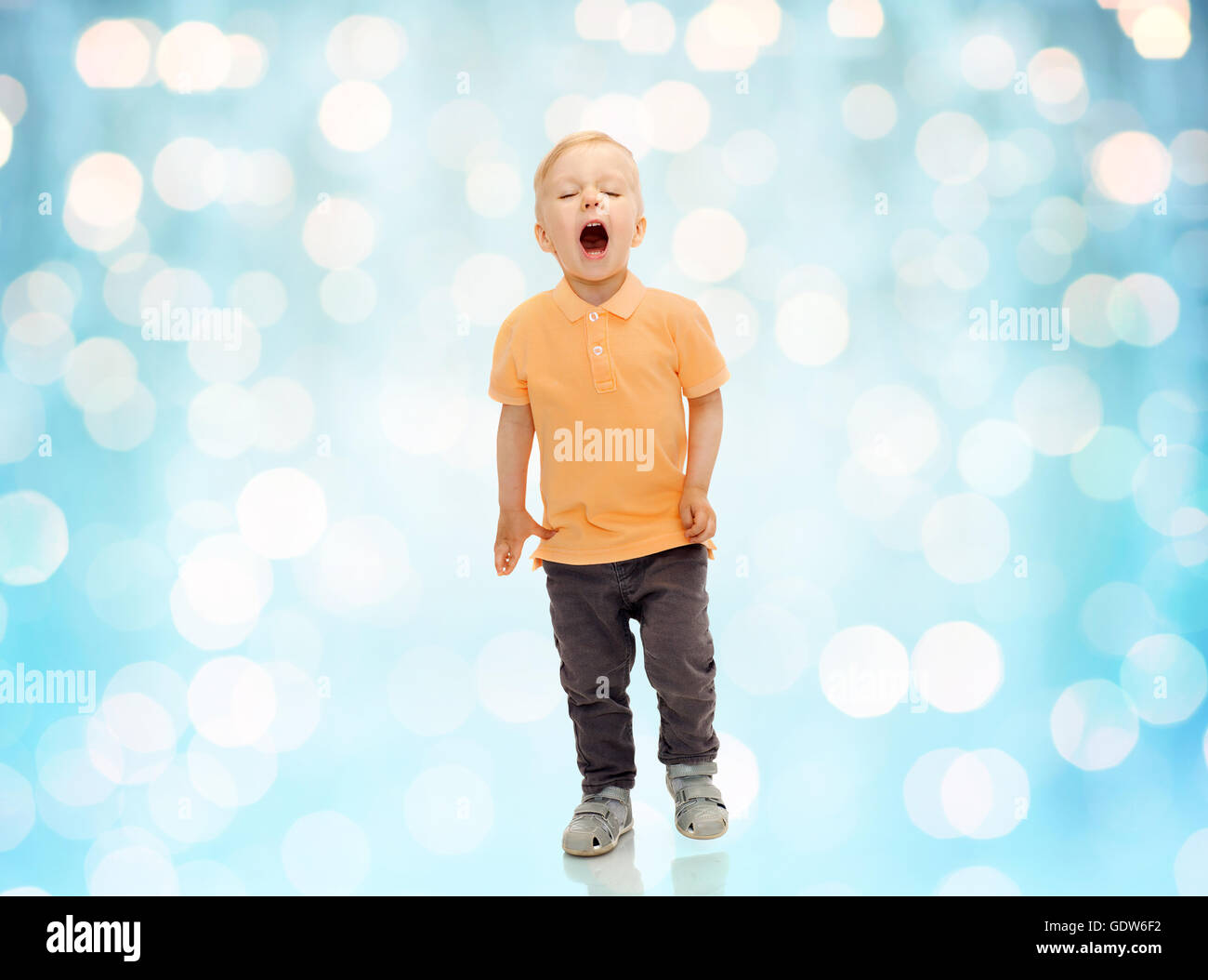 happy little boy shouting or sneezing Stock Photo