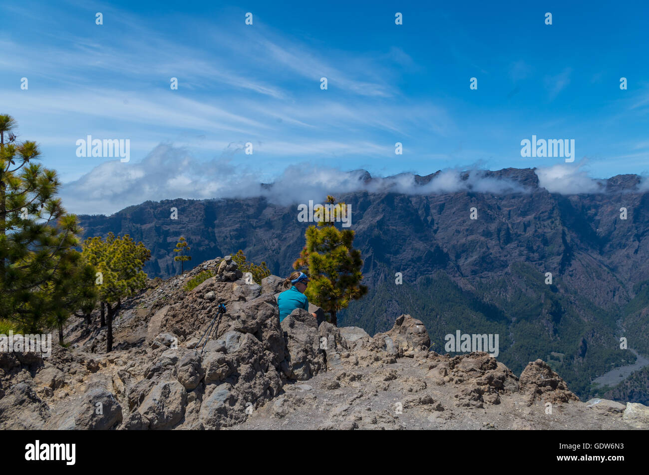 woman hiker sitting on the summit with panorama of caldera de Taburiente, La Palma, Spain Stock Photo