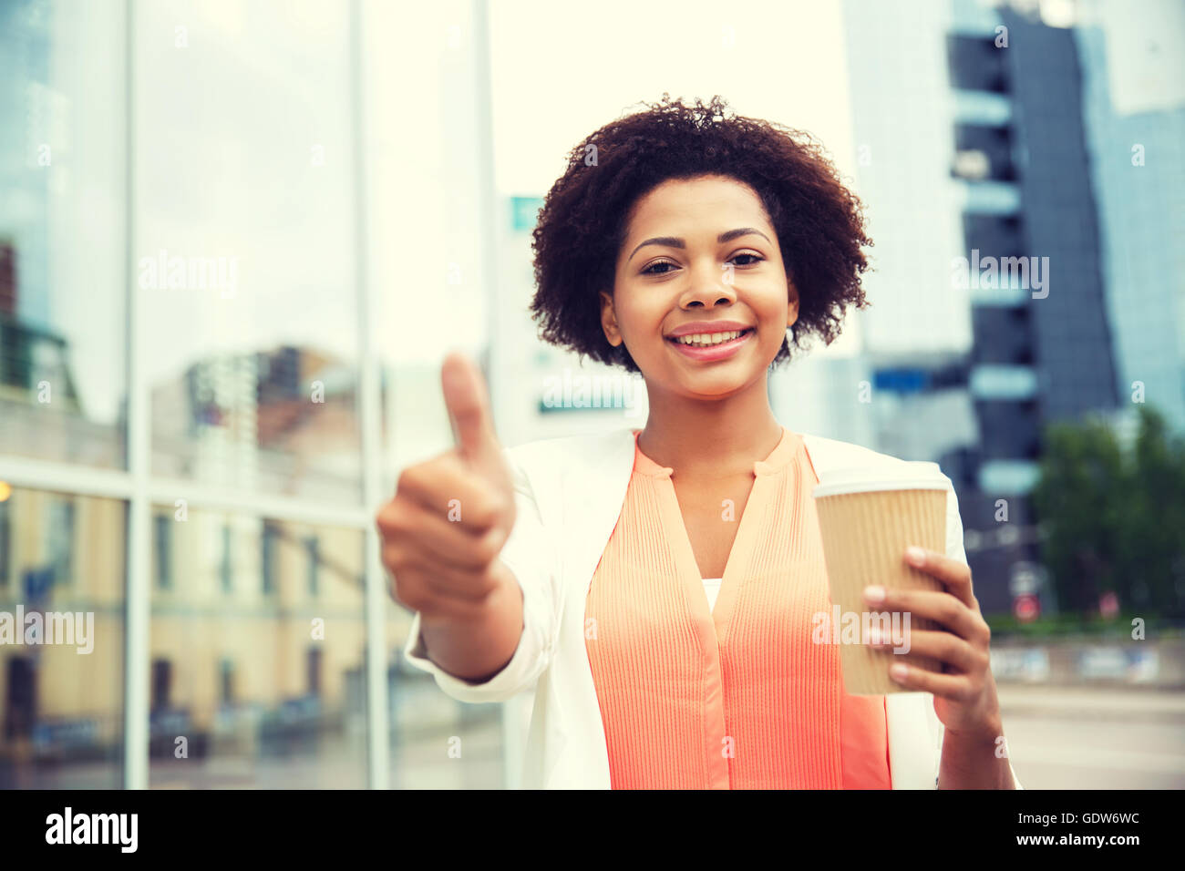 Young african woman showing thumbs hi-res stock photography and images ...