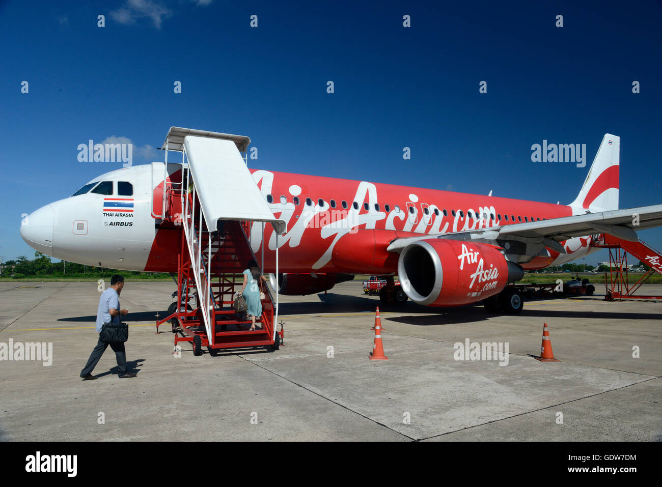 a ariplane of air asia on the airport of Ubon Rachathani in the Region of Isan in Northeast Thailand in Thailand. Stock Photo