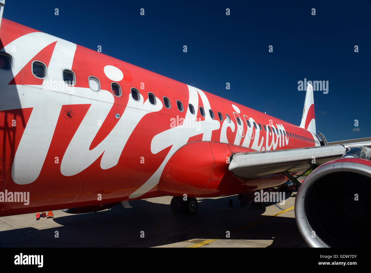 a ariplane of air asia on the airport of Ubon Rachathani in the Region of Isan in Northeast Thailand in Thailand. Stock Photo