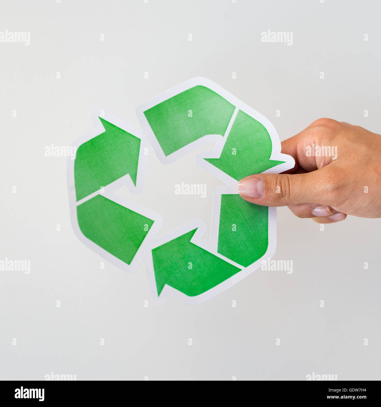 close up of hand holding green recycle symbol Stock Photo - Alamy