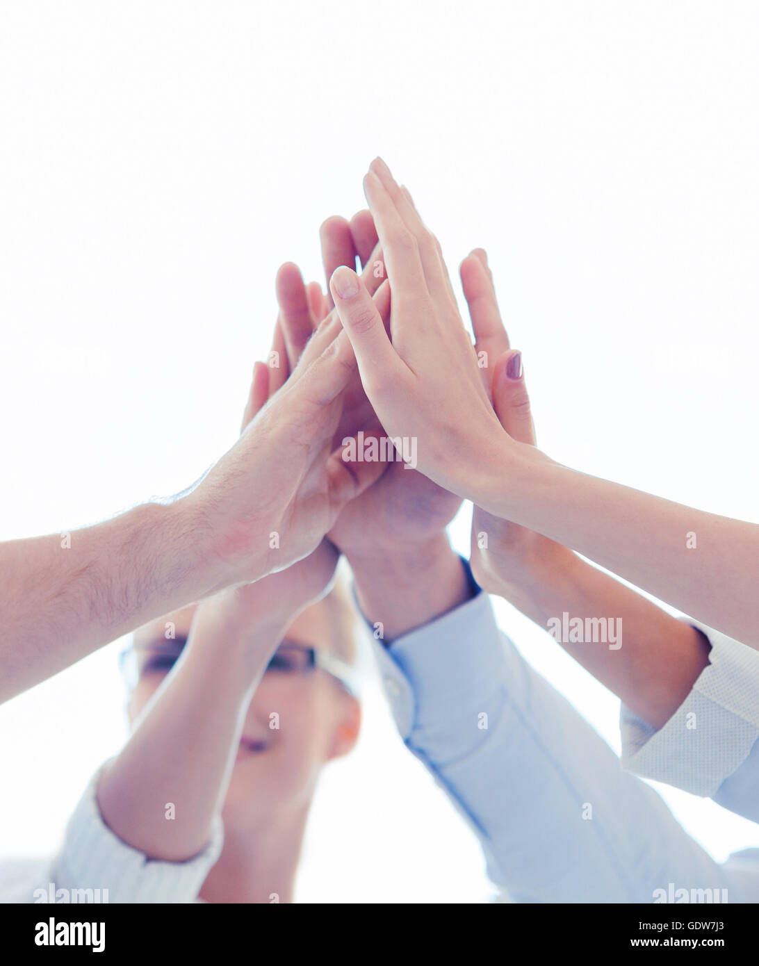 happy business team giving high five in office Stock Photo - Alamy