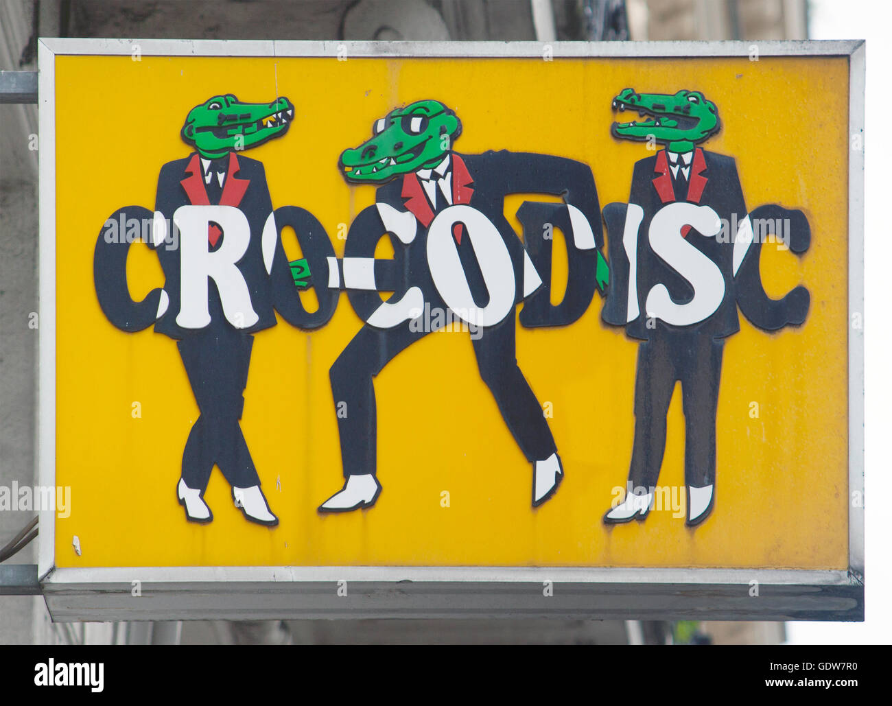 Dancing hipster crocodile sign at a record store in Paris France Stock Photo