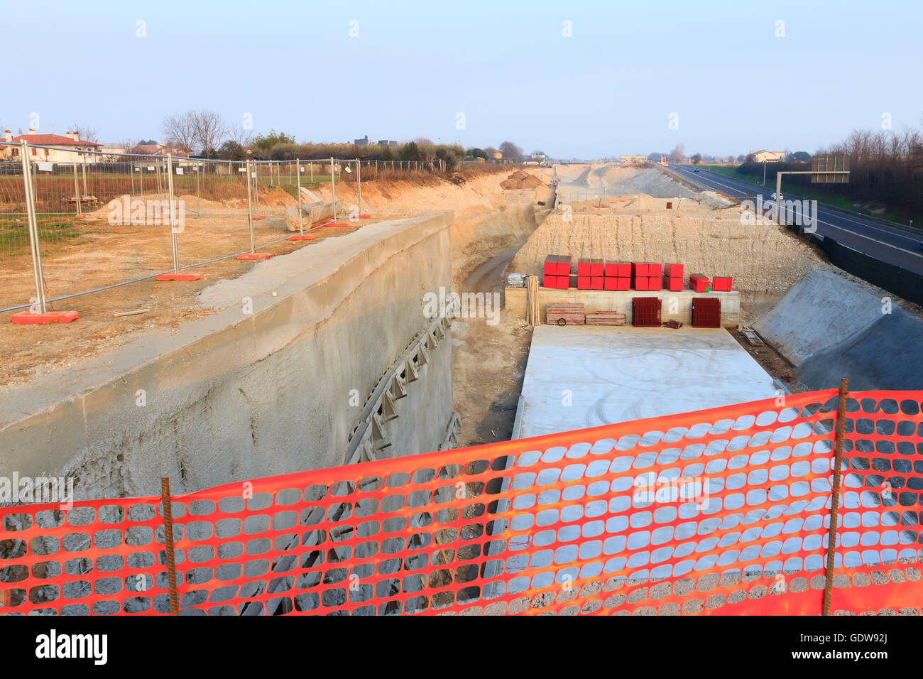 Detail of a road construction site for a new highway. Civil Engineering. Industrial Stock Photo