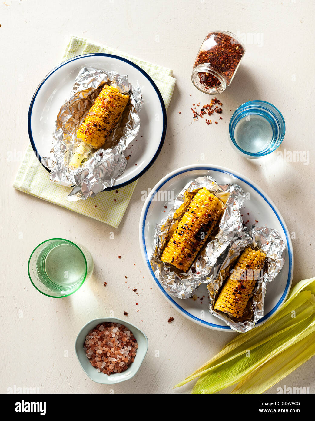 Grilled corn in aluminum foil Stock Photo Alamy