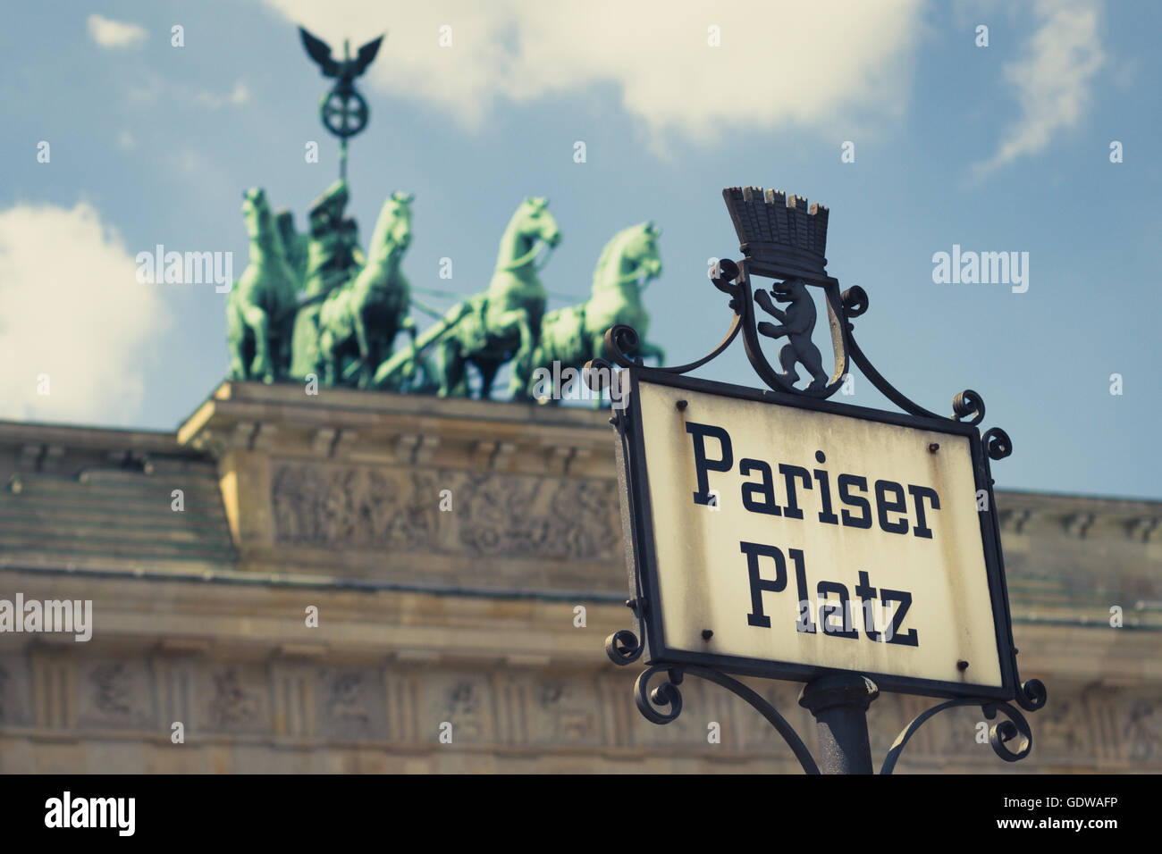 Pariser Platz street sign and brandenburg gate - vintage filter Stock Photo