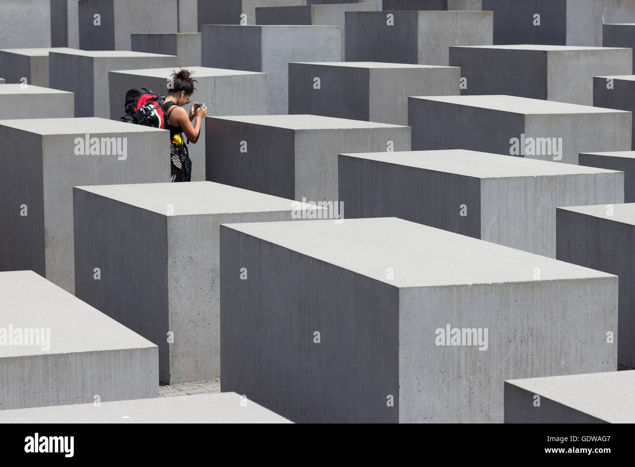 Female traveler at the Memorial to the Murdered Jews of Europe, also known as the Holocaust Memorial Stock Photo