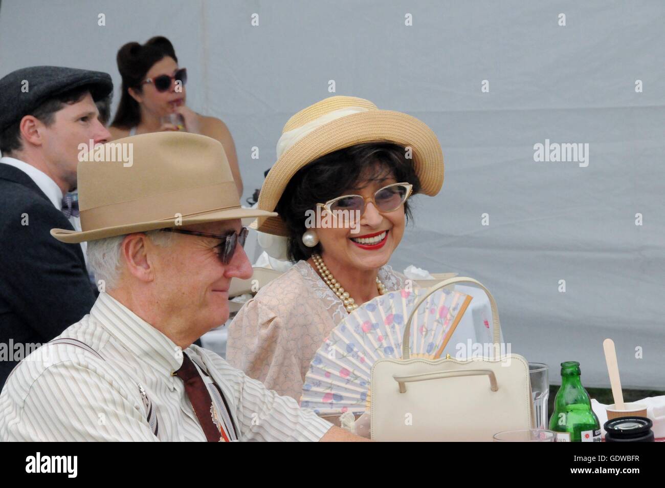 An older couple enjoy a carefree afternoon, at the 2016 Chap Olympiad, in London's Bedford Square. Stock Photo