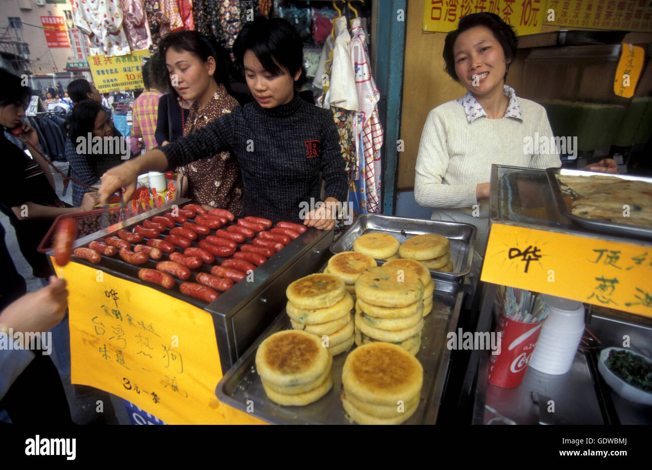fast food in a market street in the city of Shenzhen north of Hongkong in the province of Guangdong in china in east asia. Stock Photo