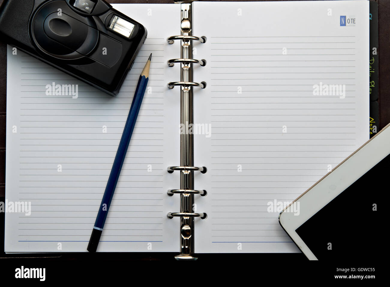 Diary and retro camera with Digital Tablet PC on a wooden table Stock ...