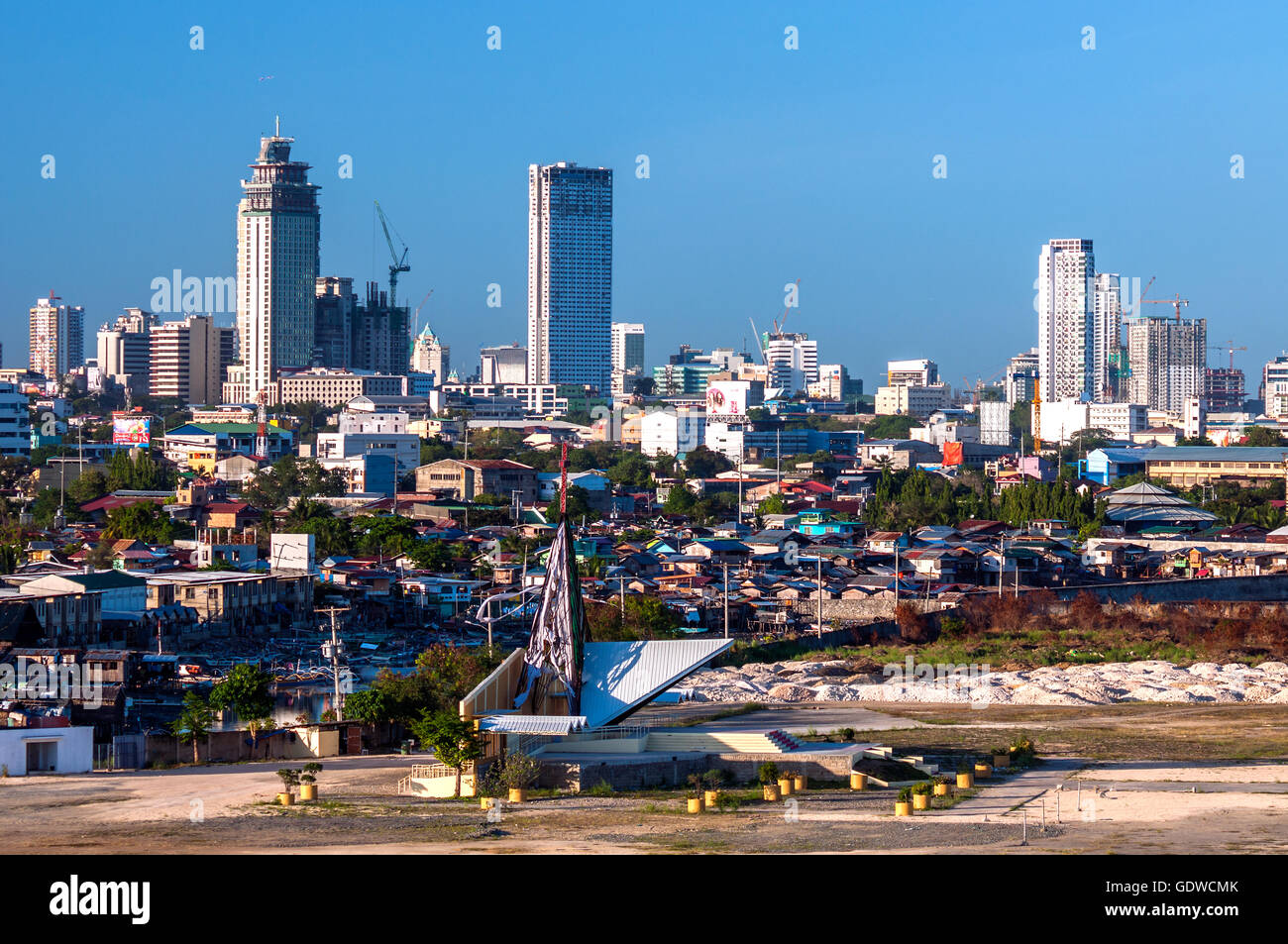 Aerial view of City skyline with low cost housing in foreground, seen from southwest, South Road Precinct, Cebu City, Philippine Stock Photo