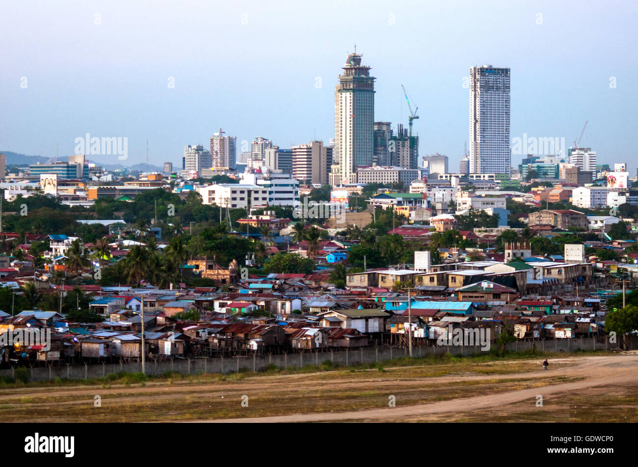 Aerial view of City skyline with low cost housing in foreground, seen from southwest, Cebu City, Philippines Stock Photo
