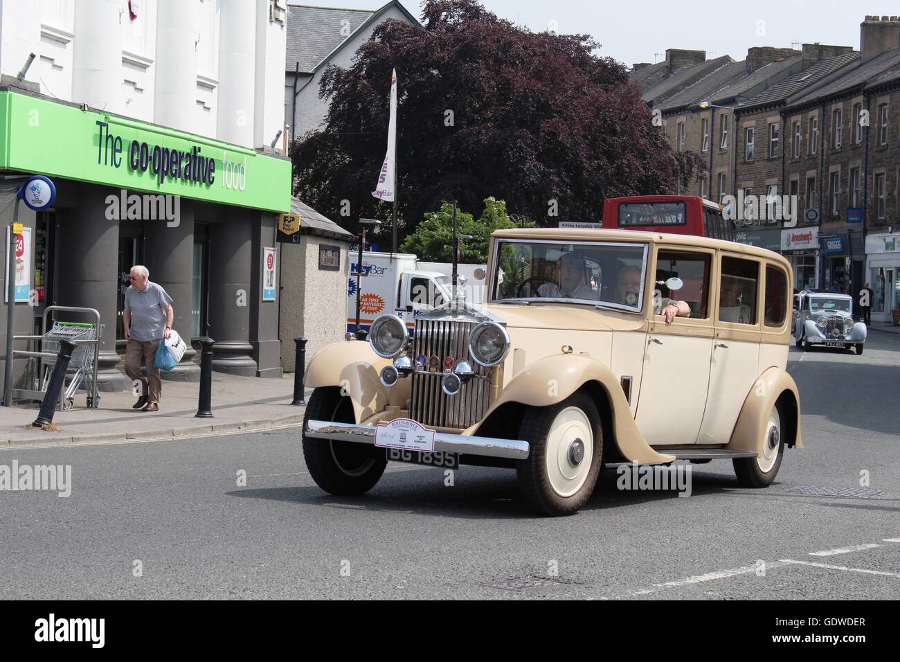 Vintage Rolls Royce car driving along Market Street, Carnforth ...