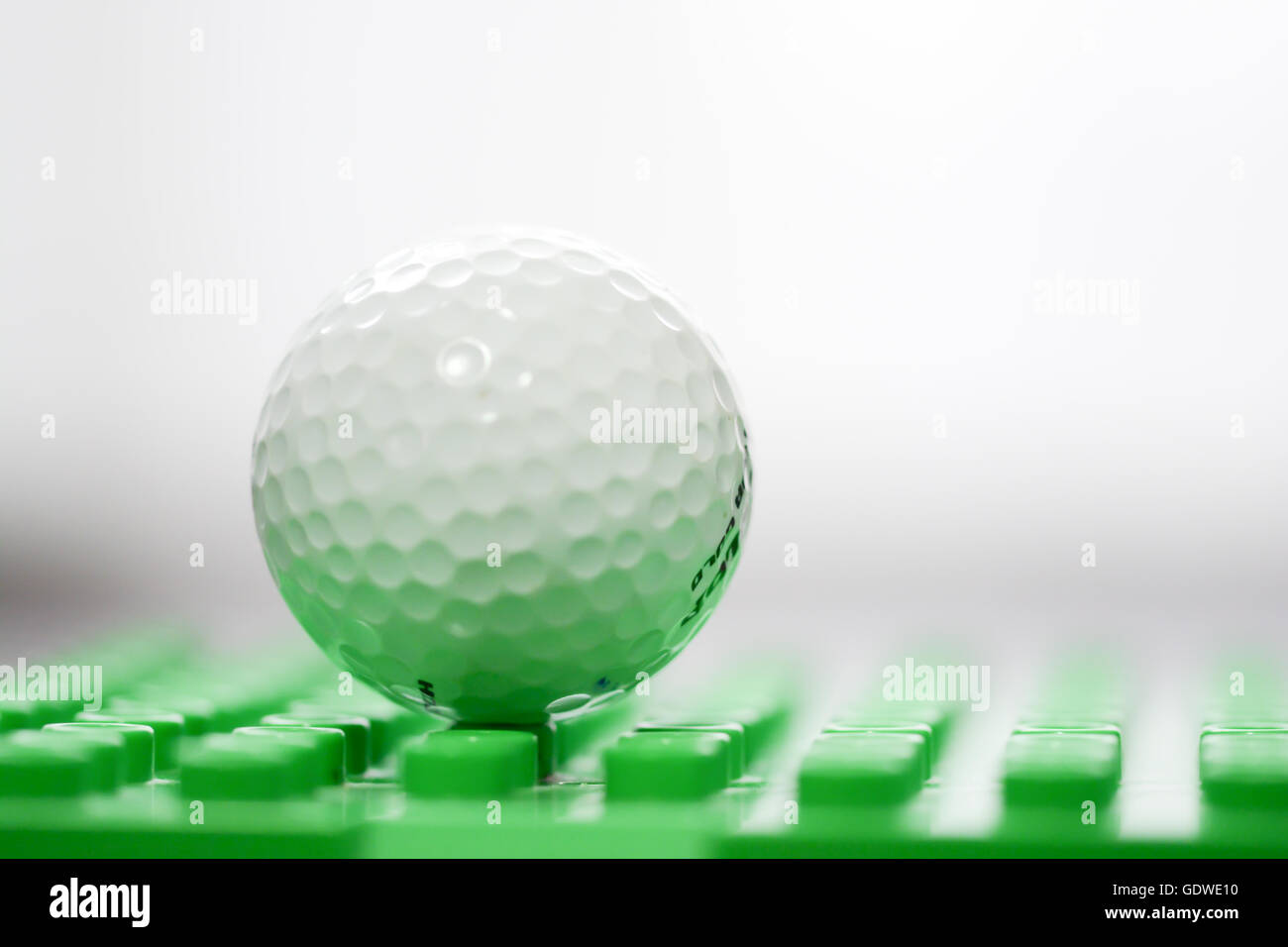 Golf ball in green grass Stock Photo Alamy