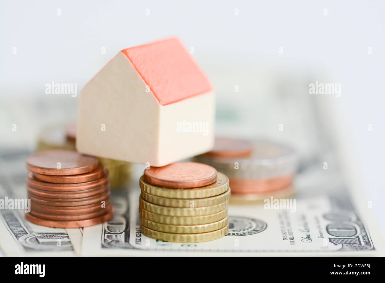 House property prices concept with money pillars from coins Stock Photo