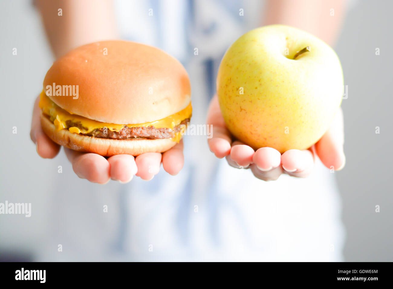 Choose between junk food versus healthy diet Stock Photo