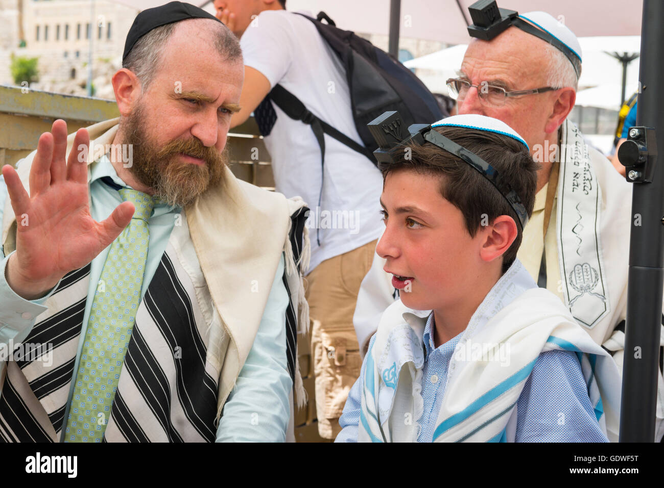 A young boy wearring his phylacteries (Tefillin), for the …